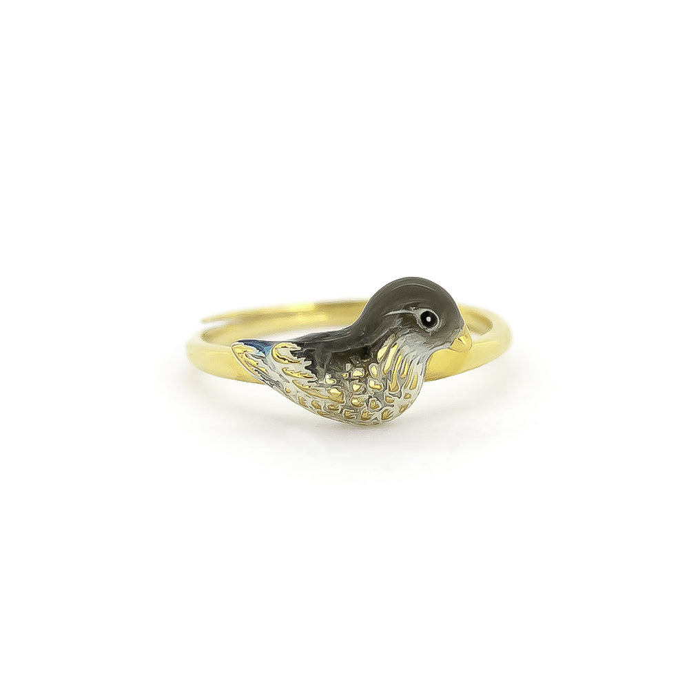 A gold rings featuring unique, intricately designed a duck design.