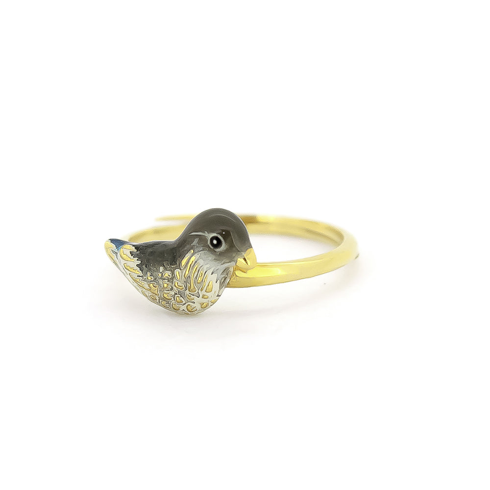 A gold rings featuring unique, intricately designed a duck design.