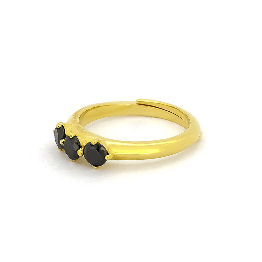 Elegant gold ring with three black synthetic gemstones