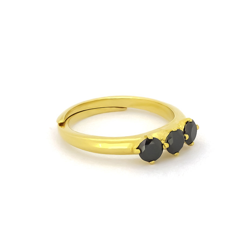 Minimalist gold ring with three black synthetic gemstones