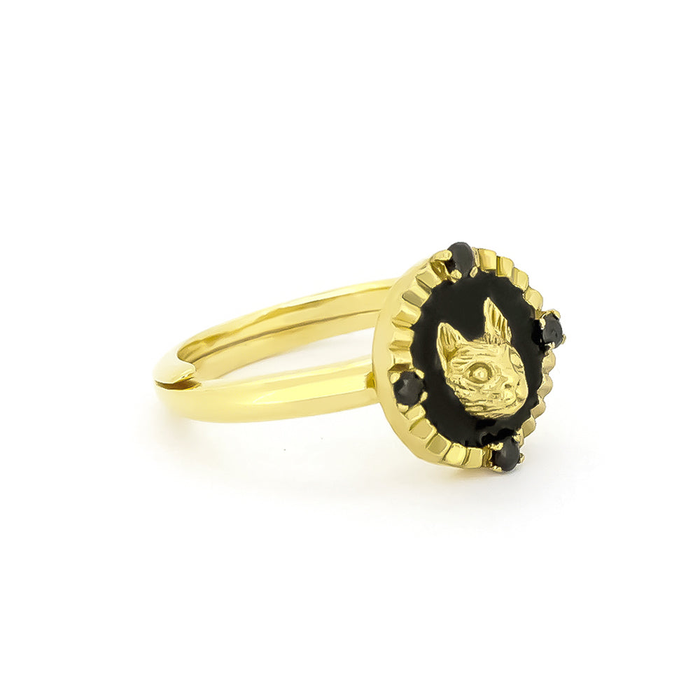 Beautiful gold cat ring featuring four small black synthetic gemstones.