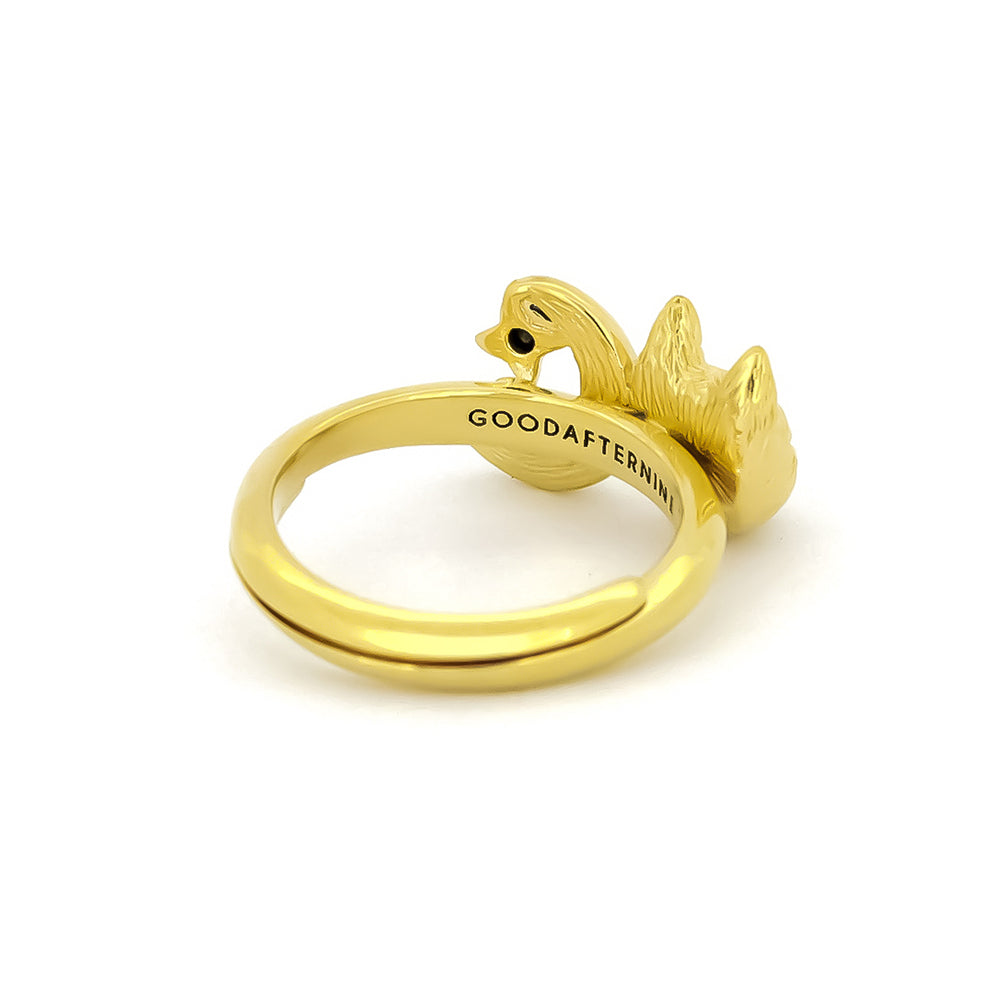 Gold ring featuring a cat head and crescent moon with two black gemstones.