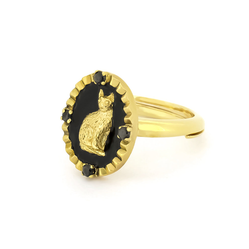 Stylish ring featuring a cat design set in a black oval, surrounded by small black gemstones.