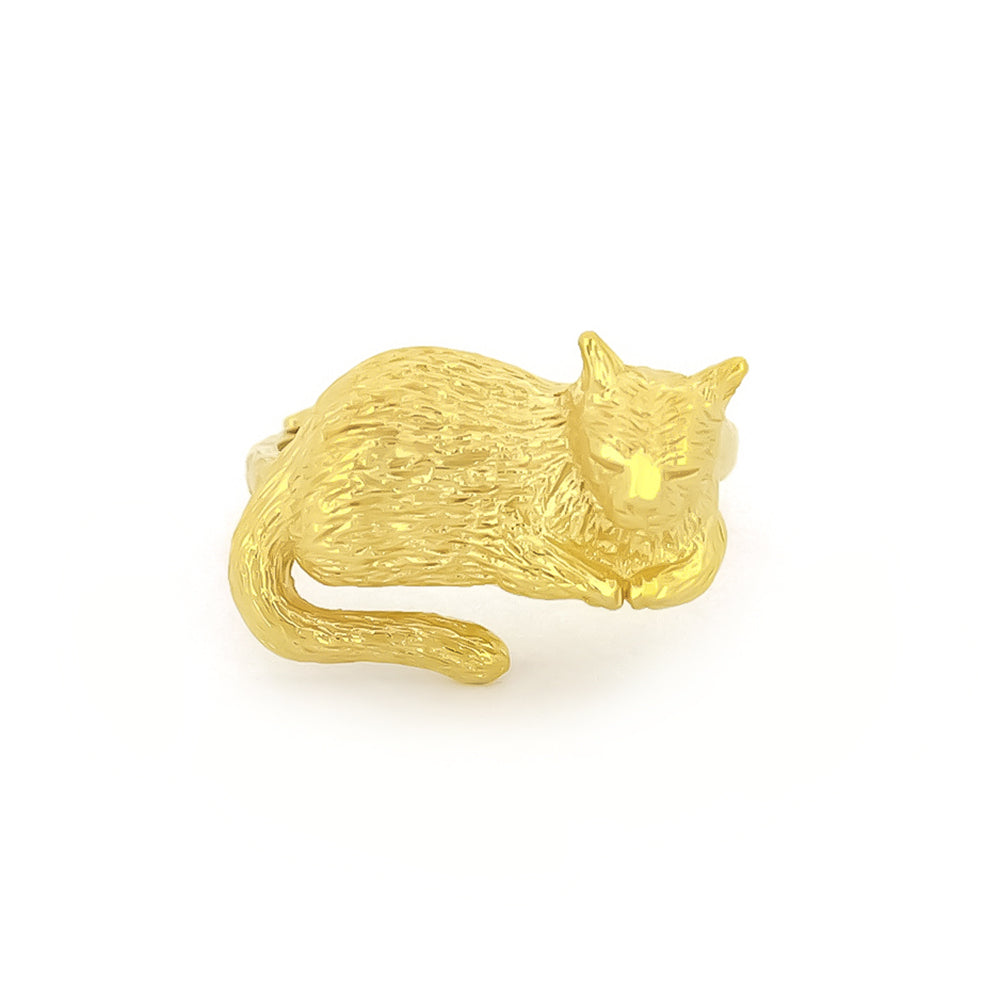 Unique gold ring featuring a sleeping cat design, highlighting their detailed craftsmanship.