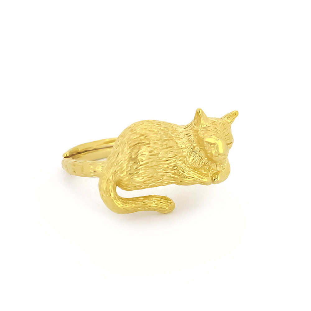 Gold ring featuring a sleeping cat design, perfect for animal lovers.