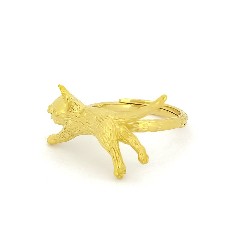 Charming gold ring featuring a sleeping cat design, perfect for animal lovers.