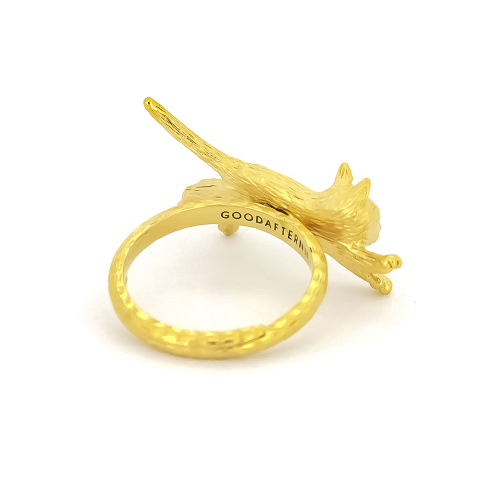 Unique gold ring featuring a sleeping cat design, highlighting their detailed craftsmanship.