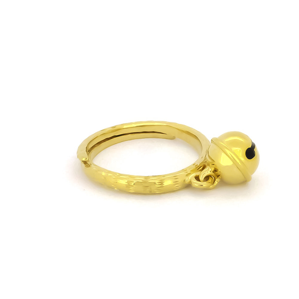 A gold ring featuring a small cat bell charm. 