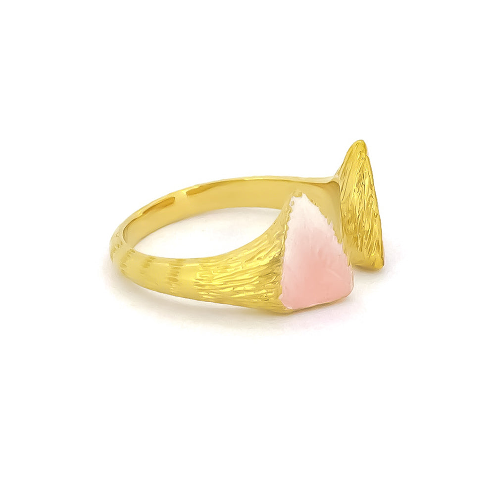 Unique gold cat ear ring with pink accents, featuring a textured design on the band.