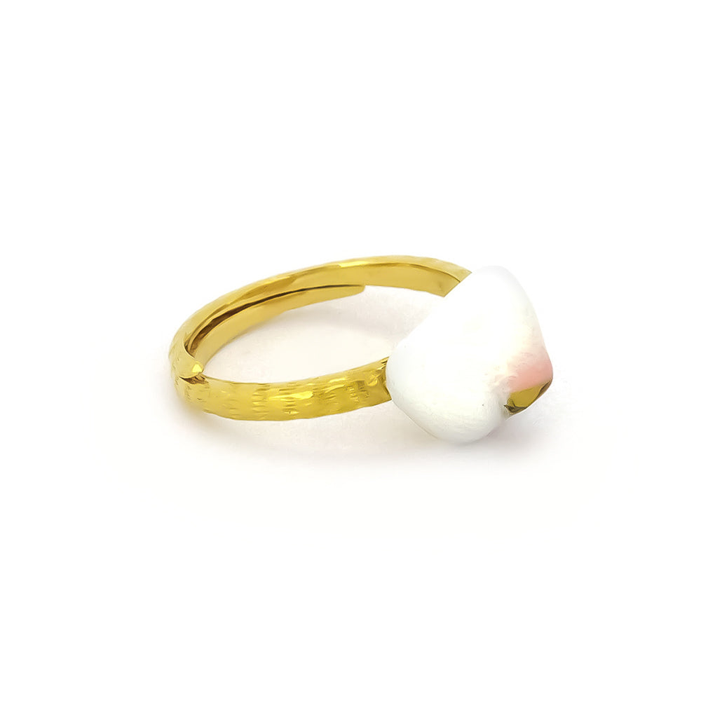 Handcrafted gold cat ring featuring a white and pink design resembling a cat's nose.