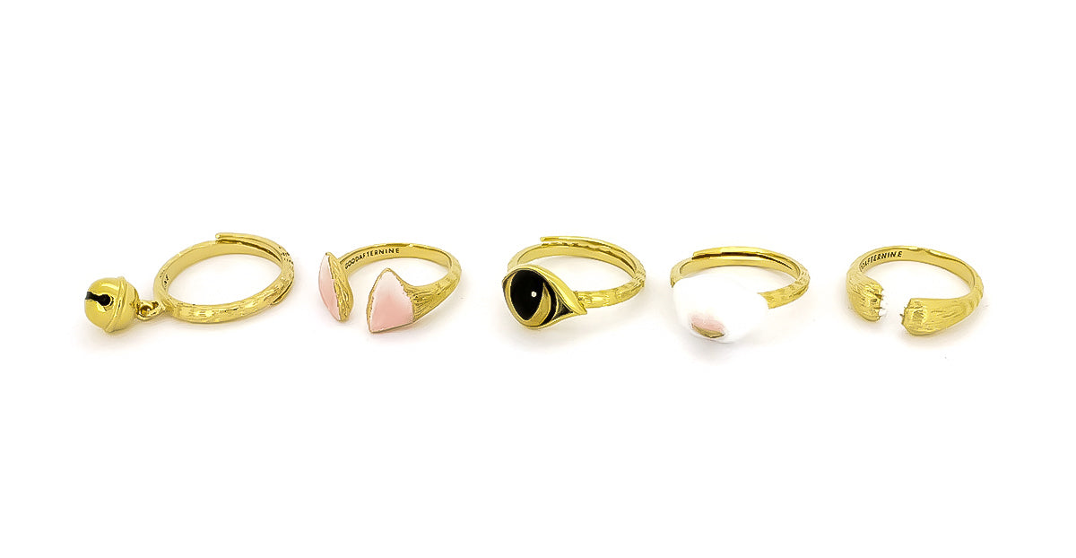 Beautifully designed gold ring collection with cat features, including ears, eyes, nose, paws and a bell.