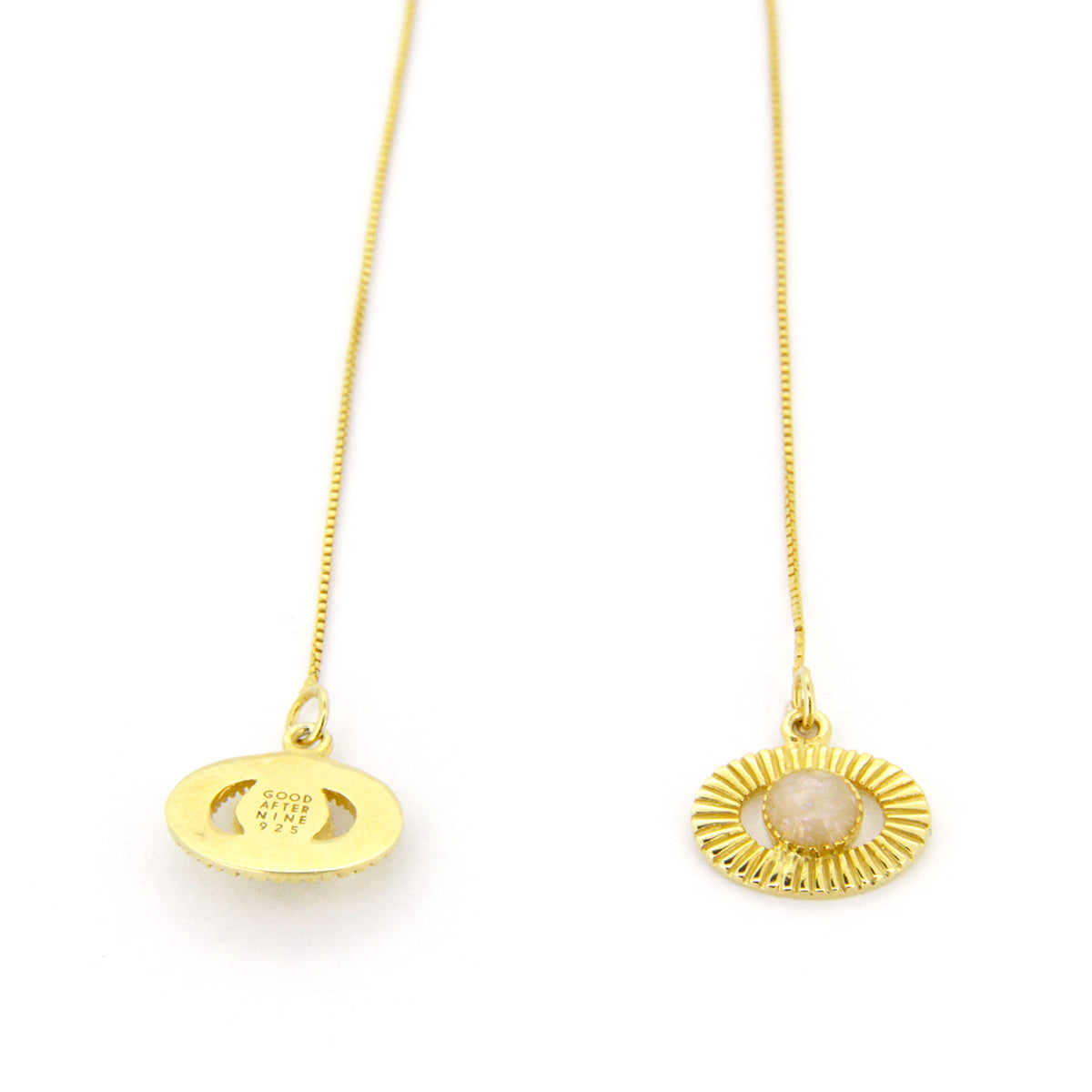 Elegant gold drop chain earrings featuring circular designs and a central stone bead.