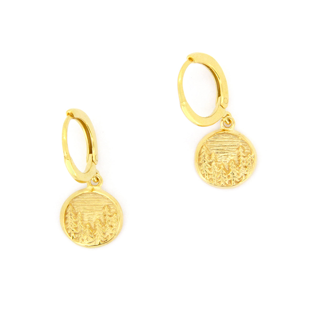 Gold earrings with circular pendants featuring a forest design, perfect for nature lovers.