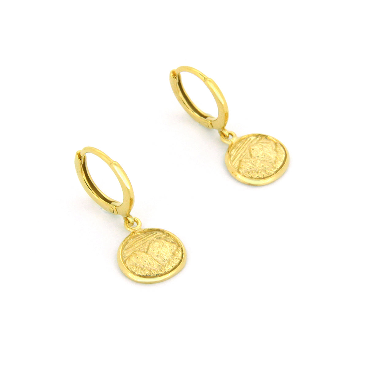 Beautiful gold earrings with circular pendants featuring detailed mountain scene.