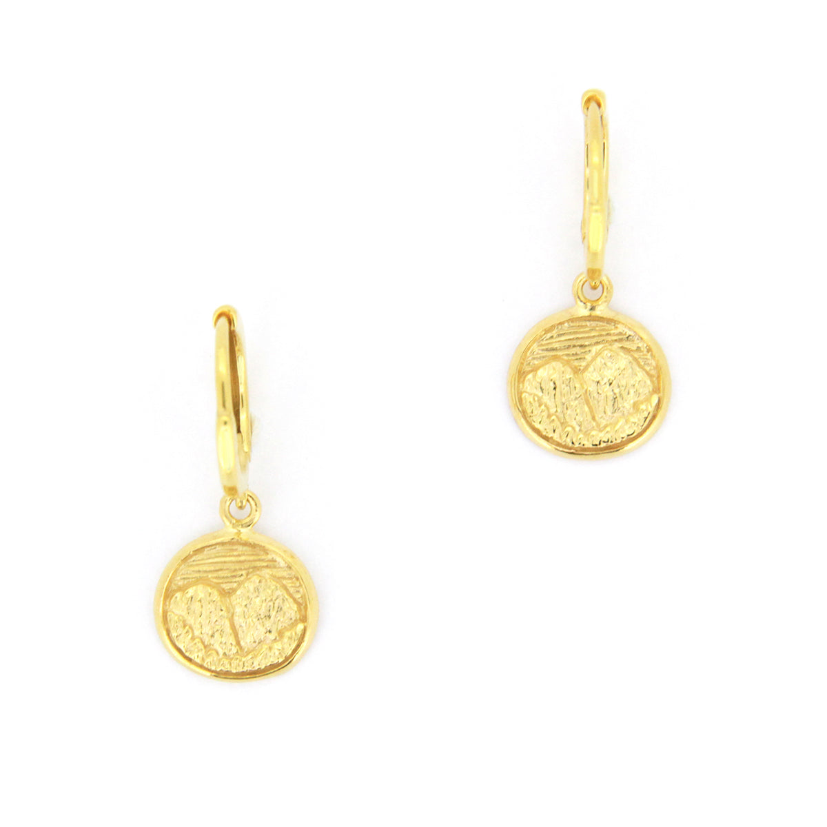 Beautiful gold earrings with circular pendants featuring detailed mountain scene.