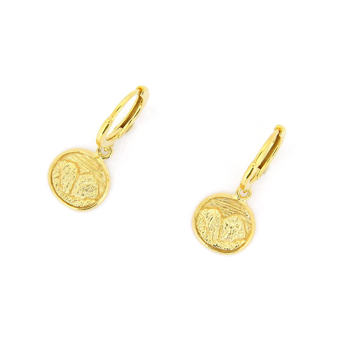 Handcrafted gold earrings with circular pendants featuring detailed mountain scene.