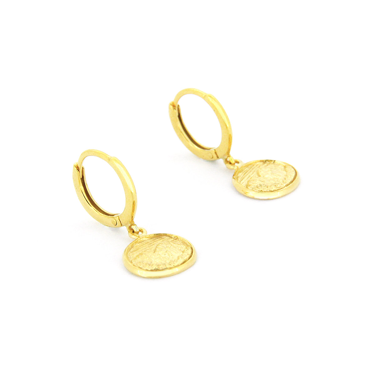 Beautiful gold earrings with circular pendants featuring detailed mountain scene.