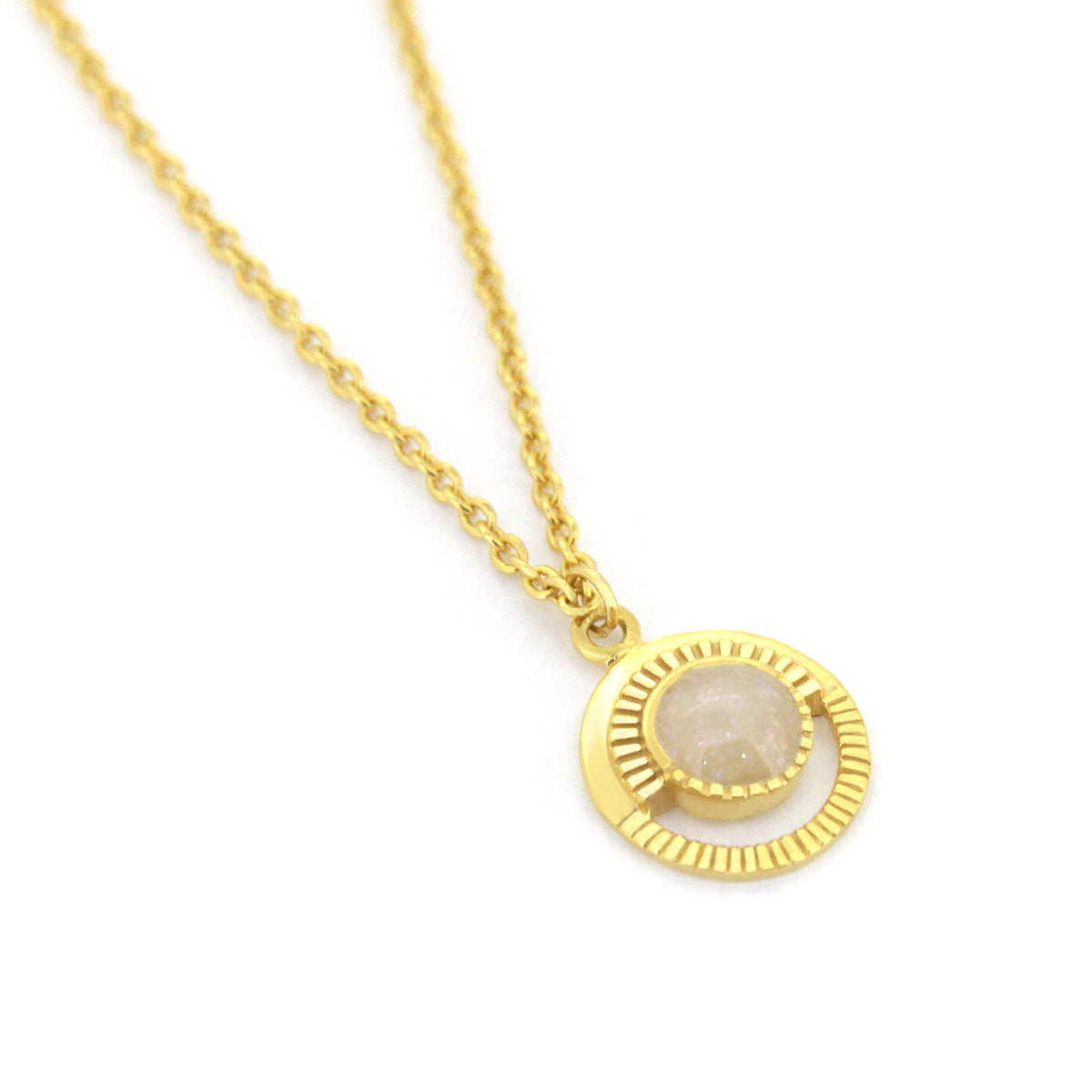 Gold necklace designed with a lunar motif and a beautiful stone centerpiece.