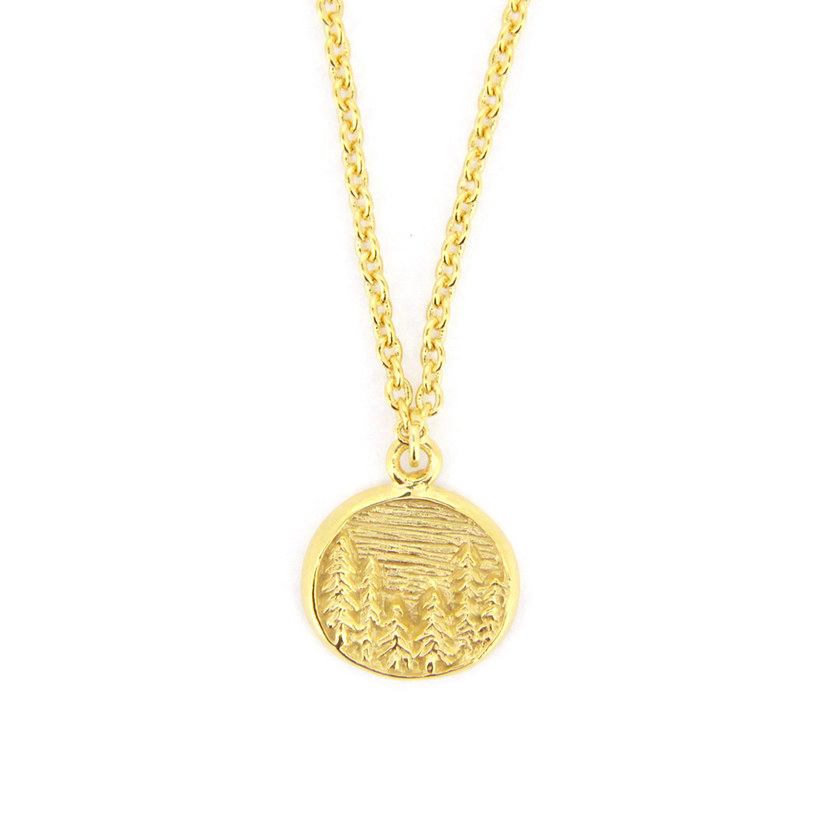 Elegant gold necklace with circular pendants featuring detailed forest scene, showcasing trees and a landscape.