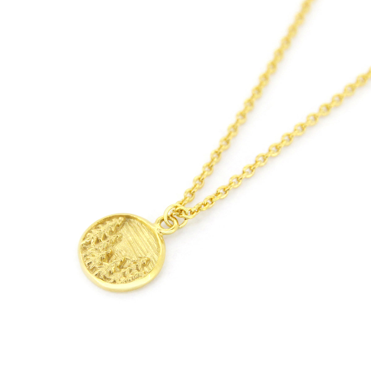 Gold necklace with circular pendants featuring a forest design, perfect for nature lovers.