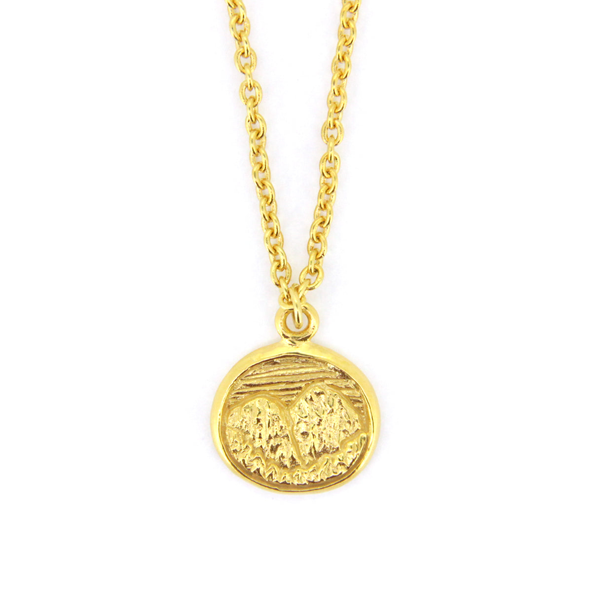 Beautifully crafted gold necklace with circular pendants featuring detailed mountain scene.