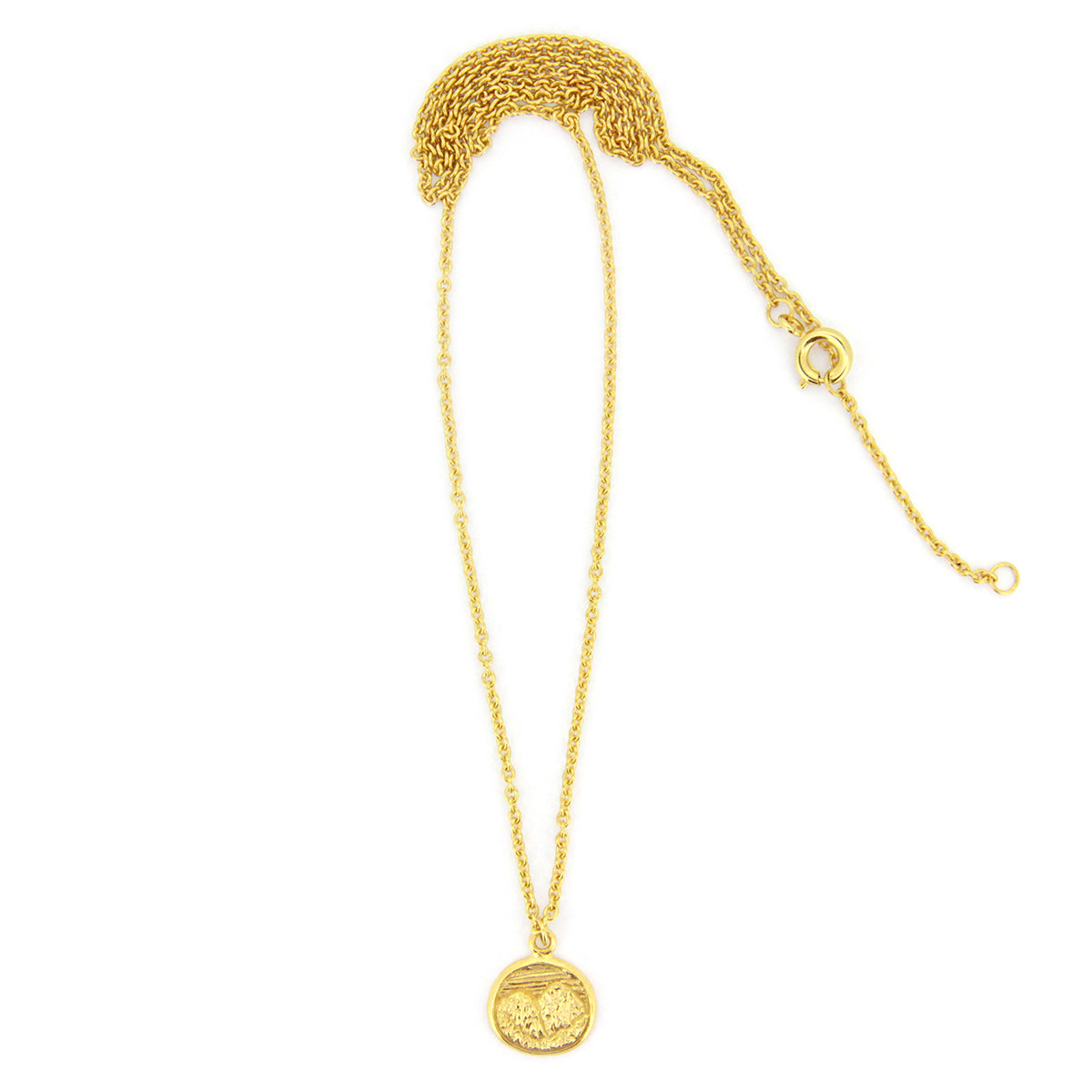 Unique gold necklace with circular pendants featuring detailed mountain scene, perfect for nature lovers.