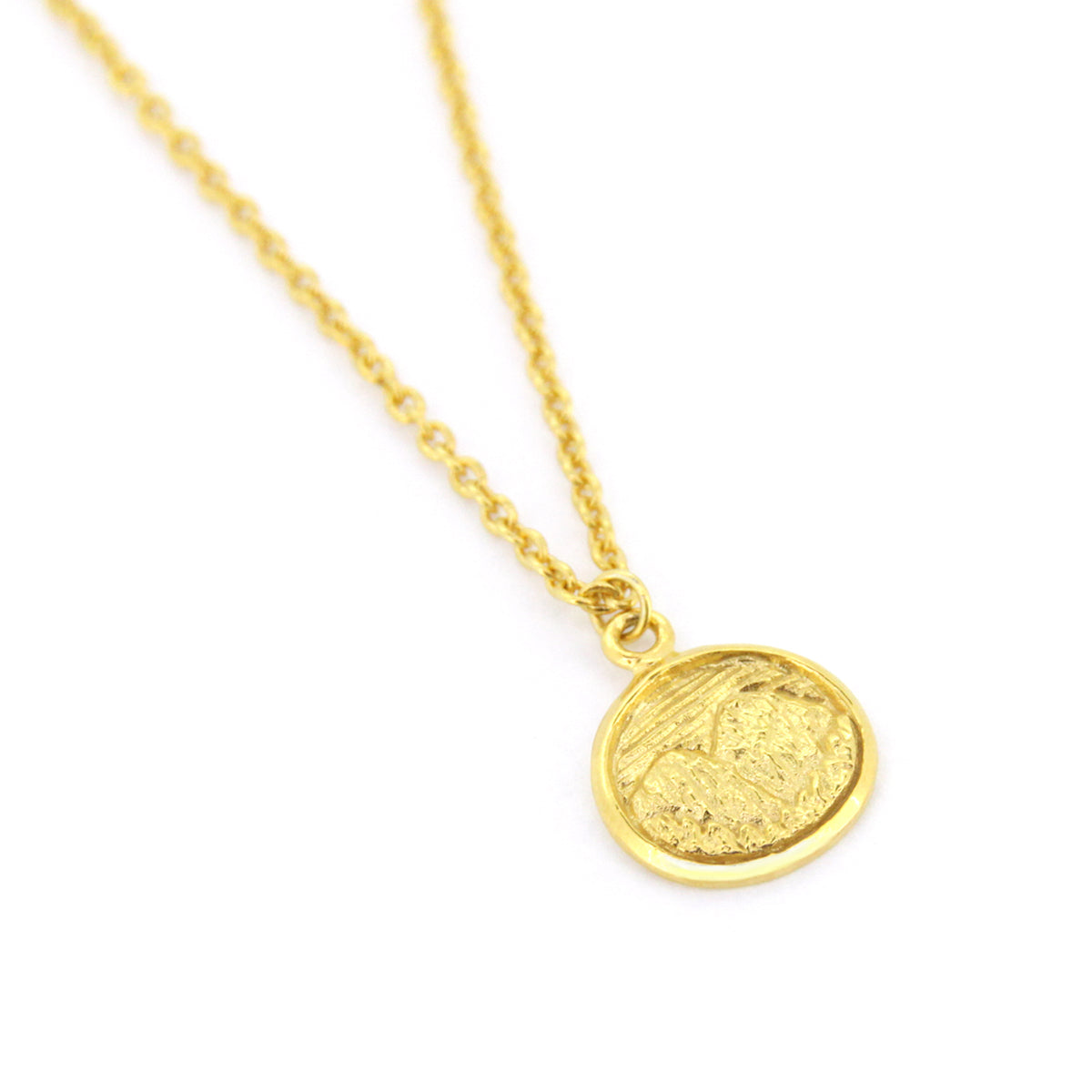 Beautifully crafted gold necklace with circular pendants featuring detailed mountain scene.