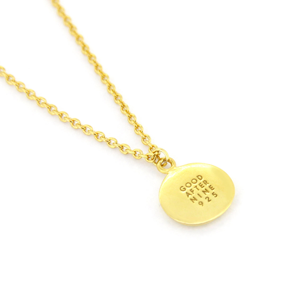 Golden necklace showcasing GoodAfterNine logo detail.