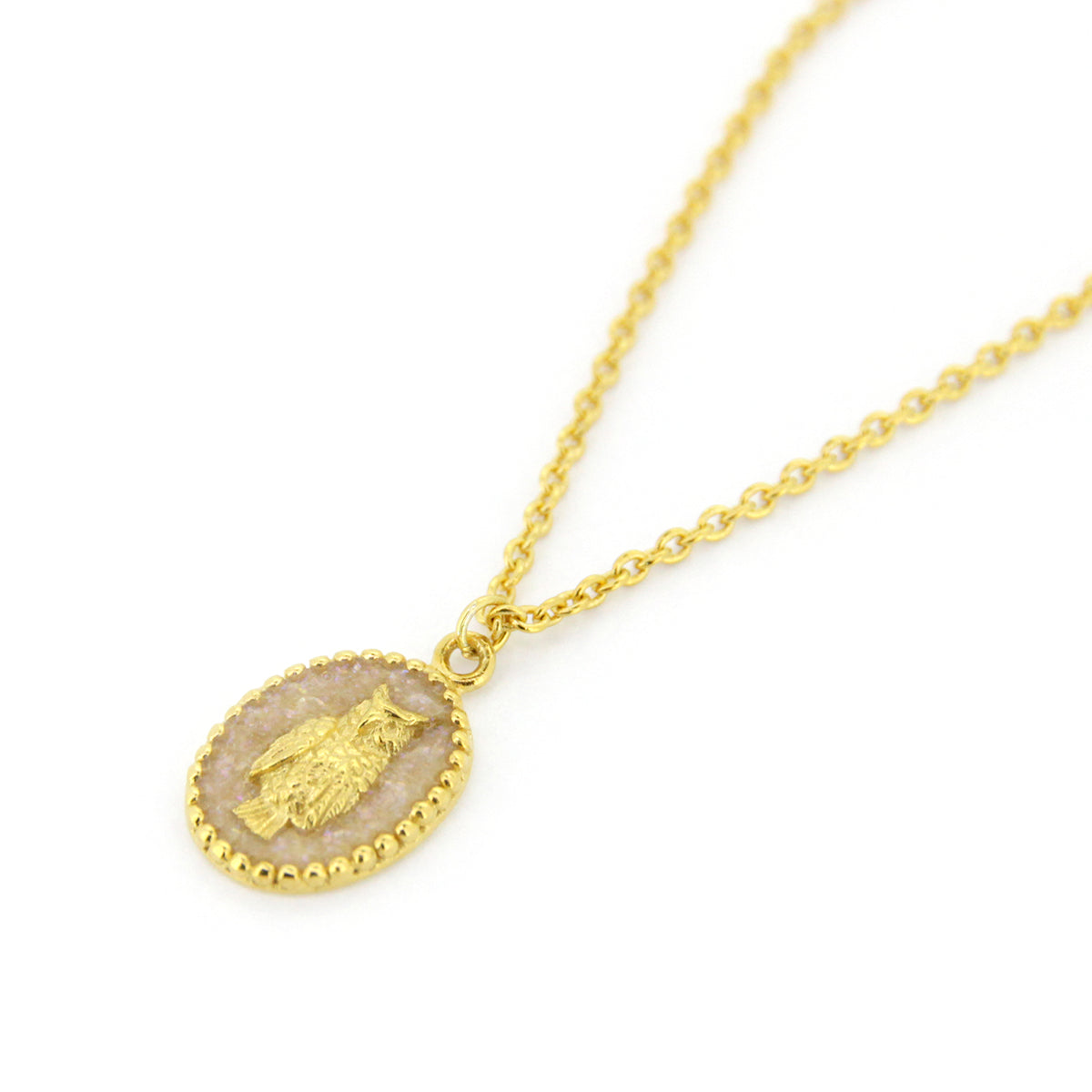 A unique gold necklace with oval charms showcasing a detailed owl design, perfect for animal lovers.