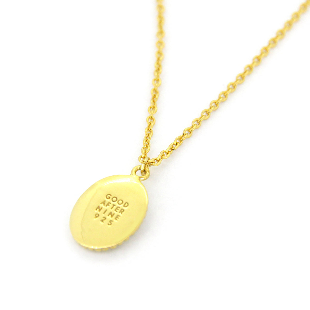 Golden necklace showcasing GoodAfterNine logo detail.