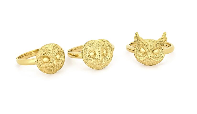 Artisan-crafted gold rings featuring charming owl designs.