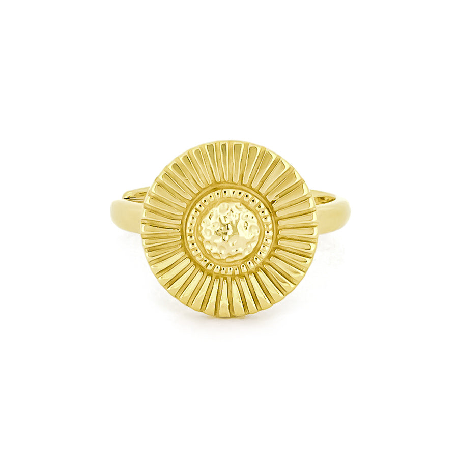 Gold ring with a textured, moon beam design and a central circular element.