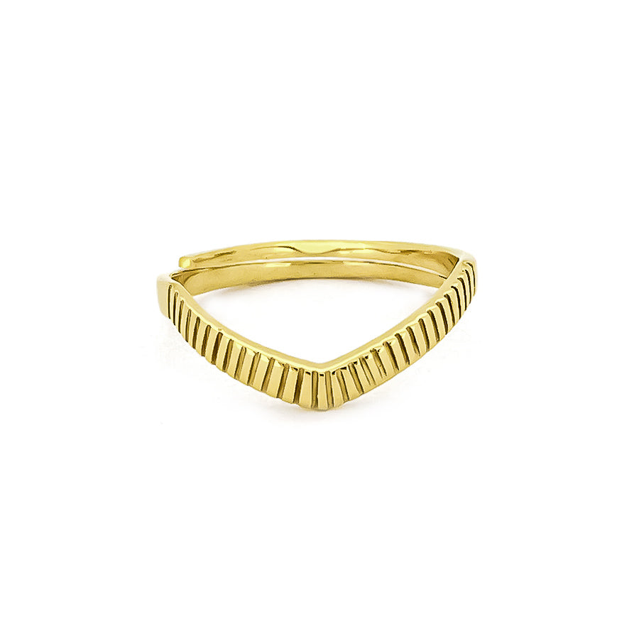 A gold ring features a unique v-shaped silhouette with a texture along its band, inspired by moon beams.