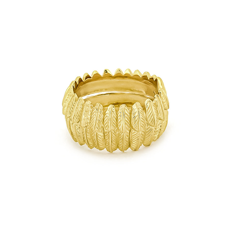 Gold ring designed with detailed owl feather motifs.