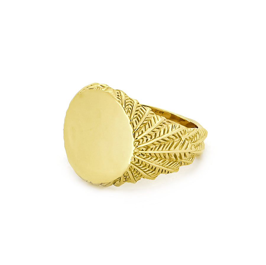 Beautiful gold ring with a smooth circular top and ornate feather-patterned band.