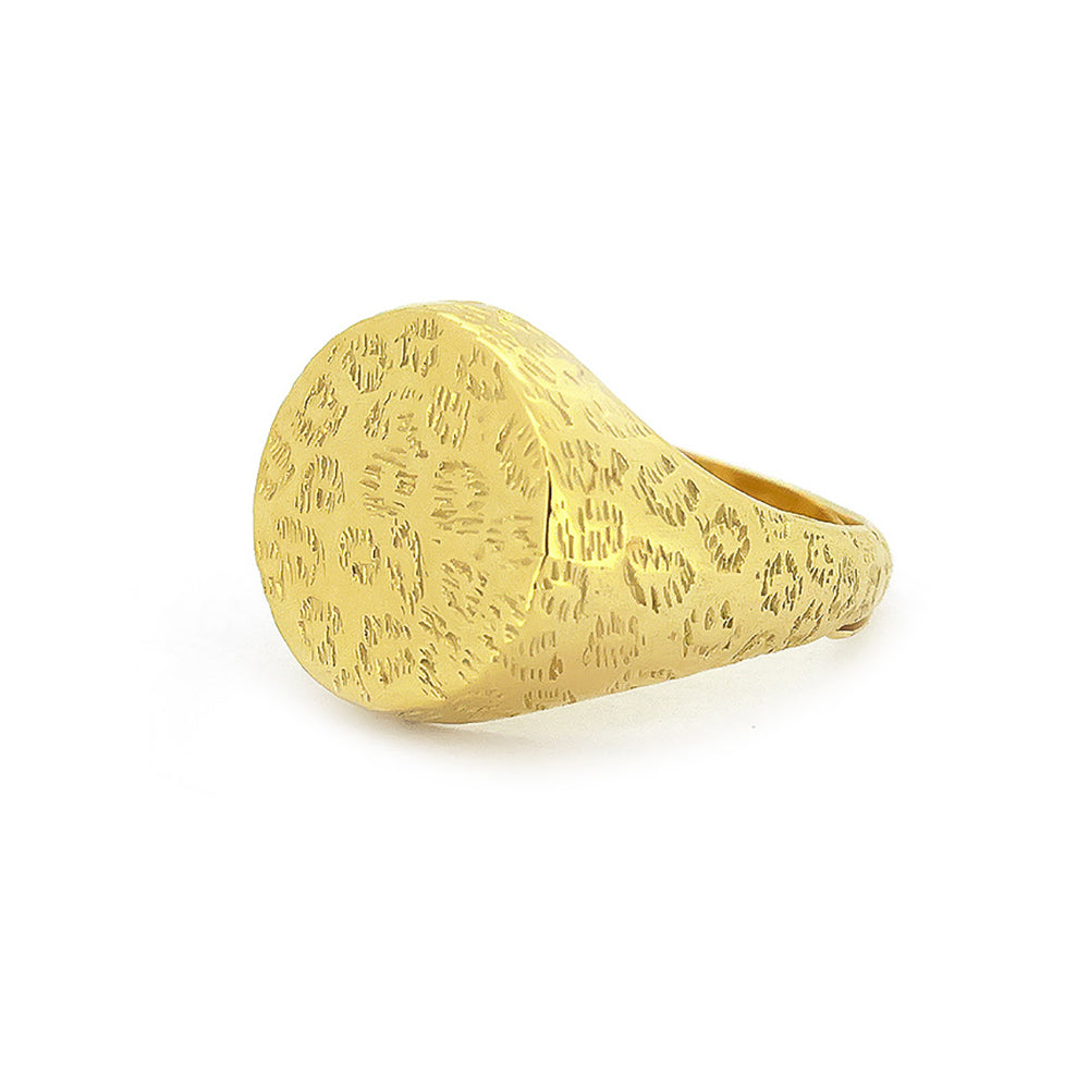 Nature-inspired gold ring with distinct textures featuring a leopard print.