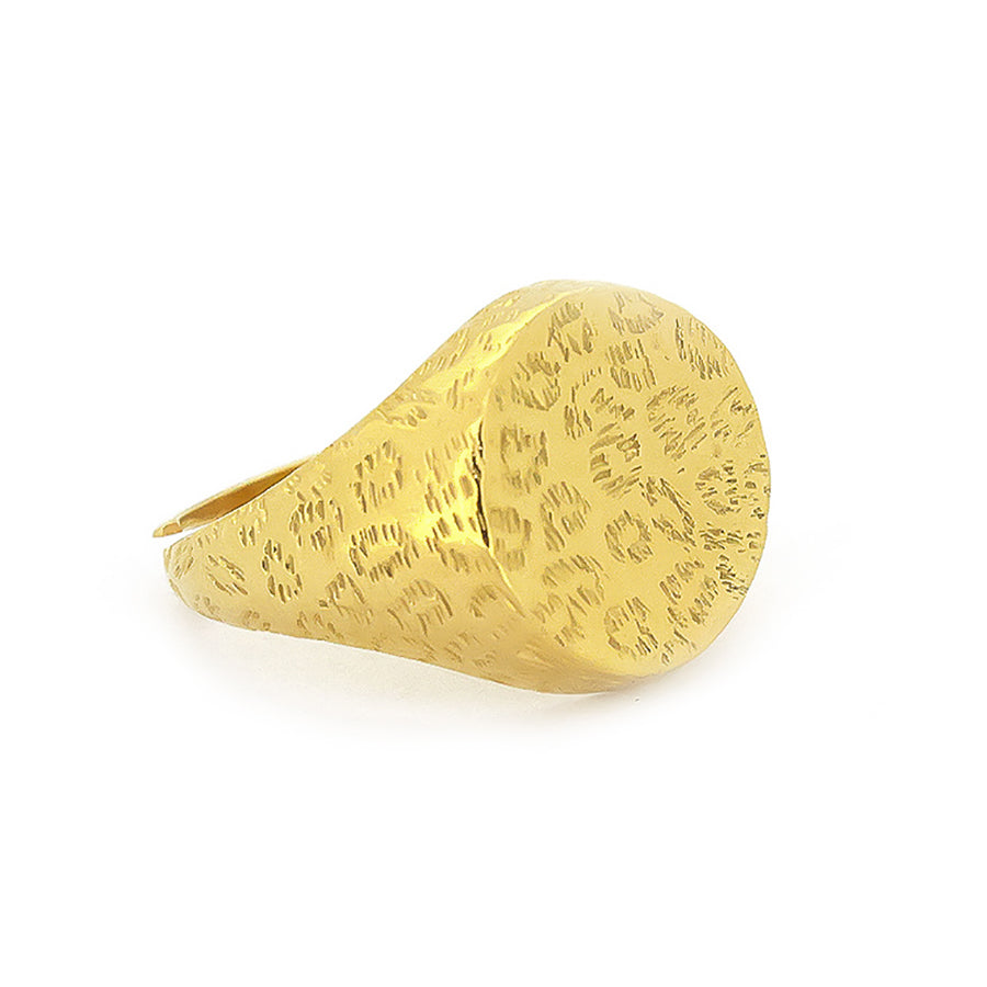 Nature-inspired gold ring with distinct textures featuring a leopard print.